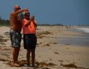 10 Beach Master and friend look for more boats.